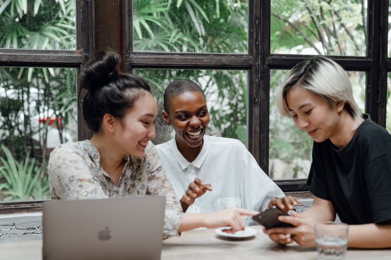 Canva - Happy multiracial friends having fun together in cafe.jpg